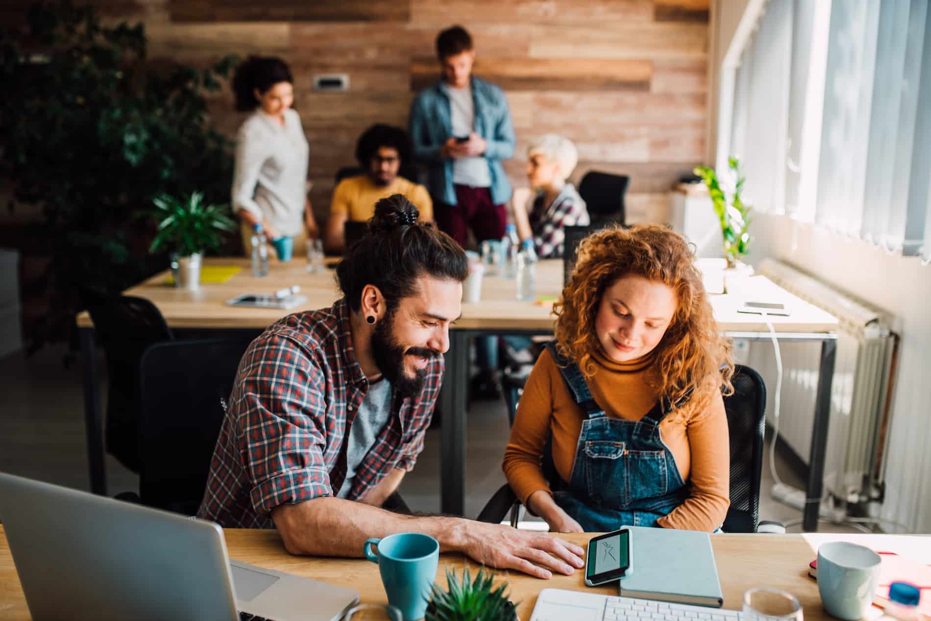 two people working together in a cafe