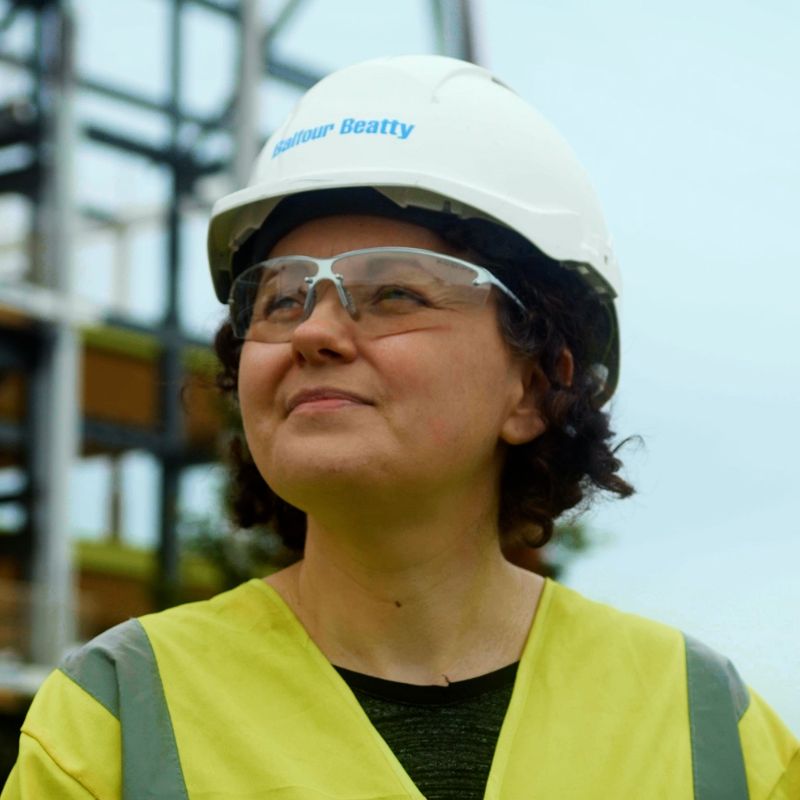 Balfour Beatty staff member wearing hard hat and high-vis vest