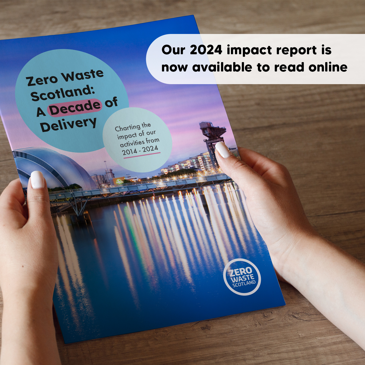 Someone holding a printed copy of a report titled 'Zero Waste Scotland: A Decade of Delivery'